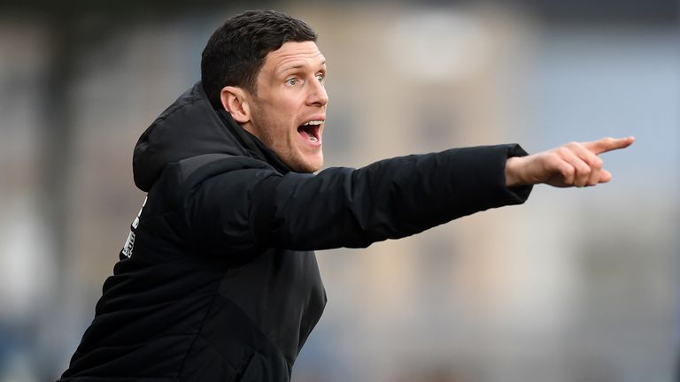 Mark Hudson of Huddersfield gestures from the bench during the Premier League match between Huddersfield Town and Arsenal FC at John Smith&#39;s Stadium on February 09, 2019 in Huddersfield, United Kingdom. 