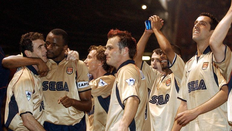 Arsenal players  celebrate after a premier league match win over Manchester United at Old Trafford 08 May 2002. The win secured Arsenal the double after winning the cup final, 04 May 2002. 