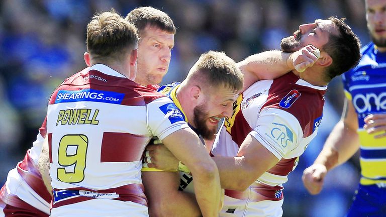 Picture by Chris Mangnall/SWpix.com - 12/05/2019 - Rugby League - Coral Challenge Cup - Warrington Wolves v Wigan Warriors - Halliwell Jones Stadium, Warrington, England -
Warrington's Matt Davis tackled by Wigan's Sam Powell tony Clubb and Bel Flower