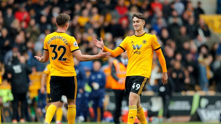Max Kilman is greeted by Leander Dendoncker after coming on for Wolves against Fulham in May 2019