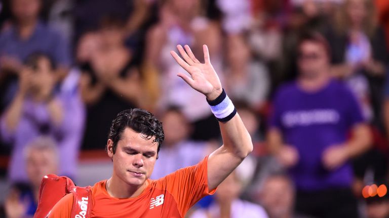 Milos Raonic cut a dismayed figure as he left the court due to a back injury 