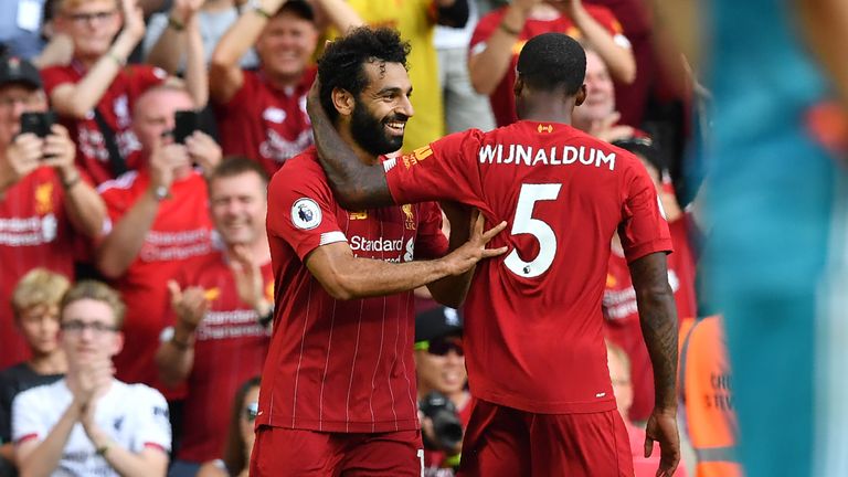 Mohamed Salah celebrates with Gini Wijnaldum after scoring for Liverpool against Arsenal at Anfield in August 2019