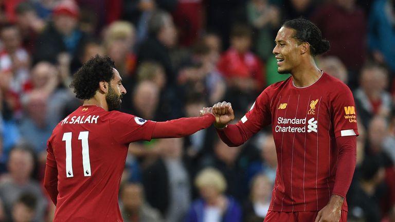 Mohamed Salah celebrates with Virgil van Dijk after scoring Liverpool's second