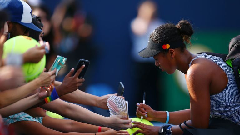 Naomi Osaka with fans after the first round at the Rogers Cup