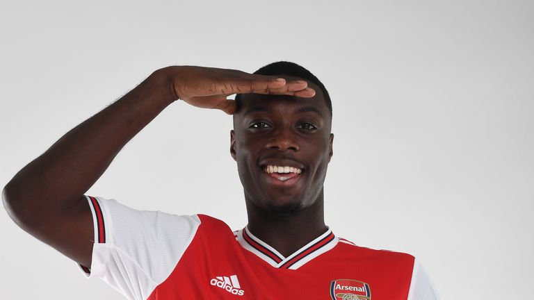 Nicolas Pepe poses during a photoshoot at London Colney