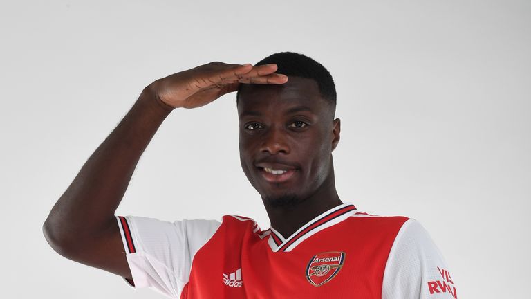 Nicolas Pepe poses during a photoshoot at London Colney