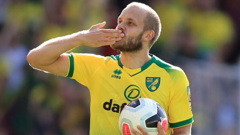 Teemu Pukki carrying the match ball after scoring a hat-trick against Newcastle
