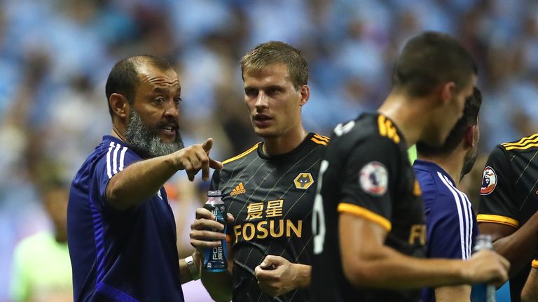 Nuno Espirito Santo talks to Ryan Bennett during the Premier League Asia Trophy final between Wolves and Manchester City