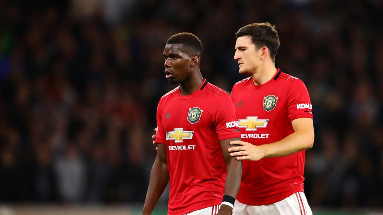 Paul Pogba and teammate Harry Maguire during the Premier League match at Molineux