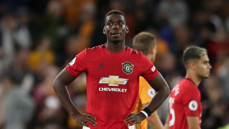 Manchester United's Paul Pogba looks dejected after the Premier League match at Molineux