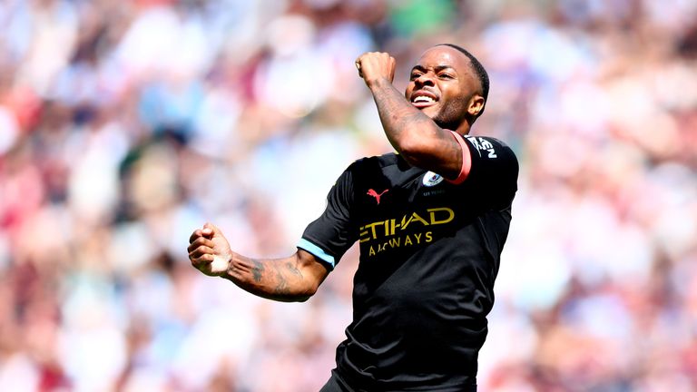 Raheem Sterling celebrates after scoring Man City's third goal against West Ham