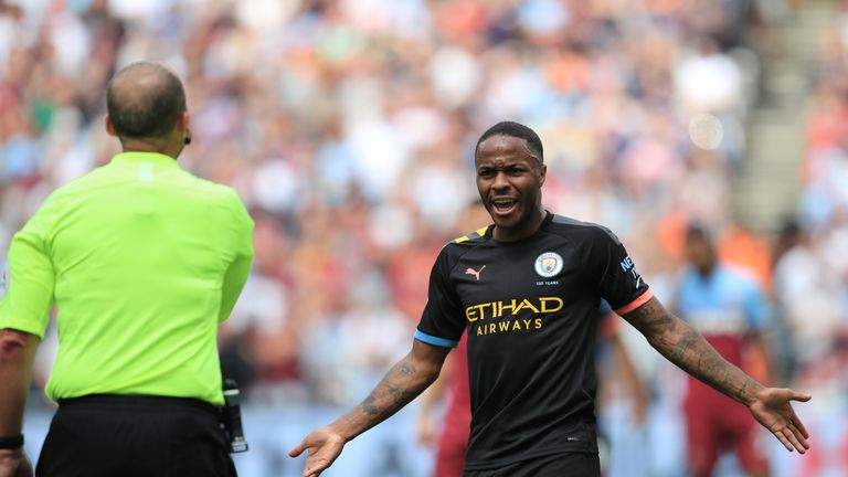 Raheem Sterling gestures towards referee Mike Dean after Manchester City&#39;s third goal is disallowed by VAR