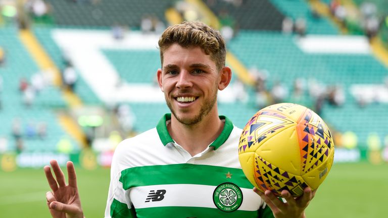 Ryan Christie celebrates with the match ball after scoring a hat-trick in Celtic&#39;s 7-0 victory
