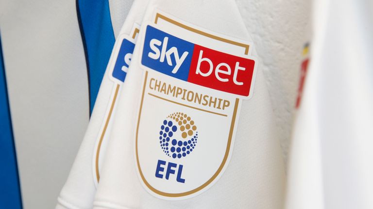 The Sky Bet Championship logo is shown on a Huddersfield Town shirt
