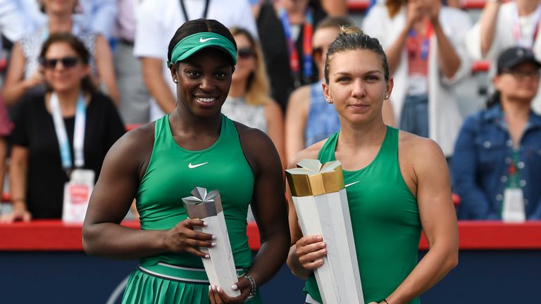 Sloane Stephens and Simona Halep hold their trophies after competing in the final of the 2018 Rogers Cup