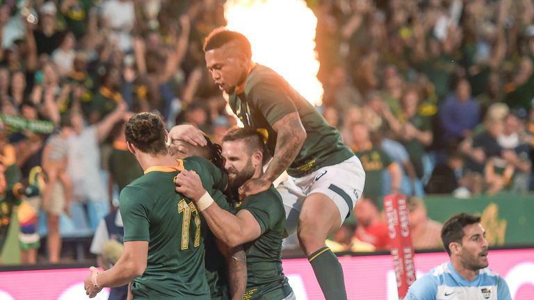 South Africa wing Nkosi celebrates with his team mates after scoring a try 