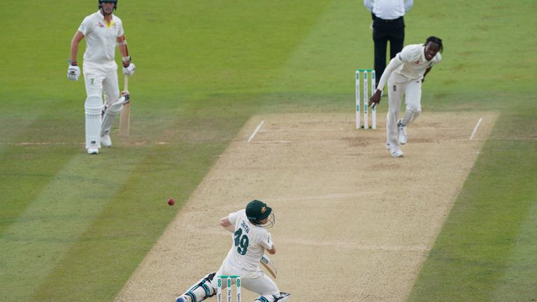 Smith is hit on the neck from a high ball from England bowler Jofra Archer