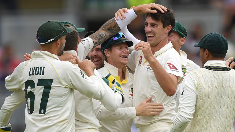 Pat Cummings of Australia celebrates with Steven Smith and teammates after taking the final wicket of Chris Woakes of England to win the 1st Specsavers Ashes Test between England and Australia at Edgbaston on August 05, 2019 in Birmingham, England.