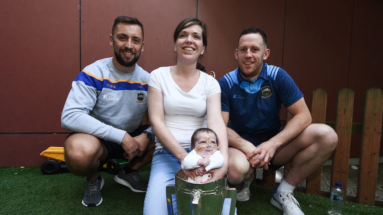 James Barry, left, and Seán O'Brien of Tipperary with Stacey Hughes and her daughter Leila Hughes-McDermott, aged 6 weeks, from Enniscrone, County Sligo