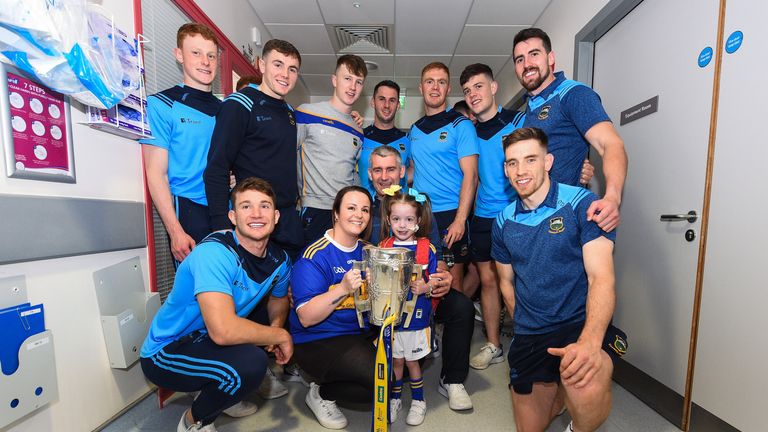 Holly Carroll, aged 4, and her mother Jessica, from Clonmel, County Tipperary pose with the Liam MacCarthy Cup