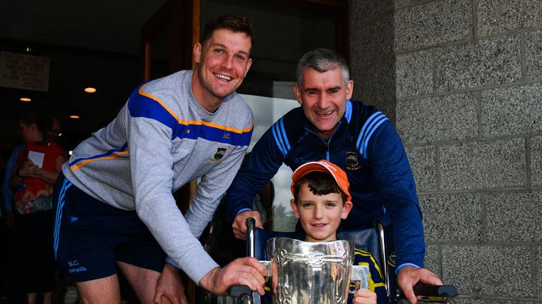 Séamus Callanan and Liam Sheedy with Luke Marum, aged 10, from Portlaoise