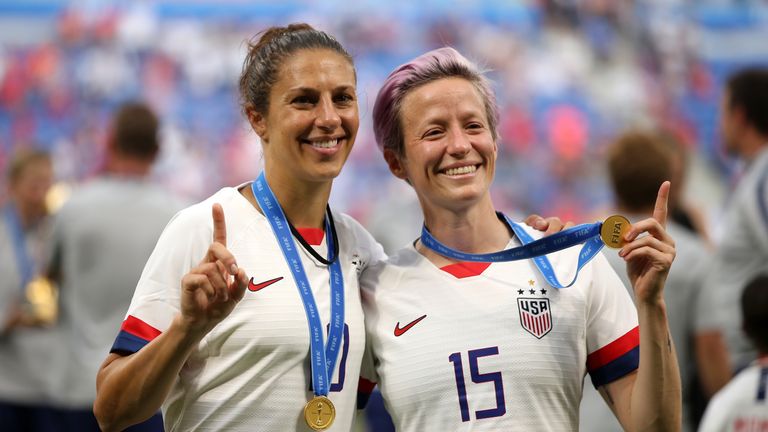 Lloyd, left, celebrates Megan Rapinoe after the USA's victory at the Women's World Cup