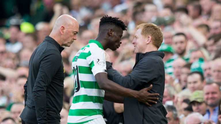 Vakoun Bayo embraces manager Neil Lennon during Sunday's 3-1 win over Hearts