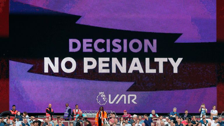 A big screen at the London Stadium displays the VAR decision not to award West Ham a penalty