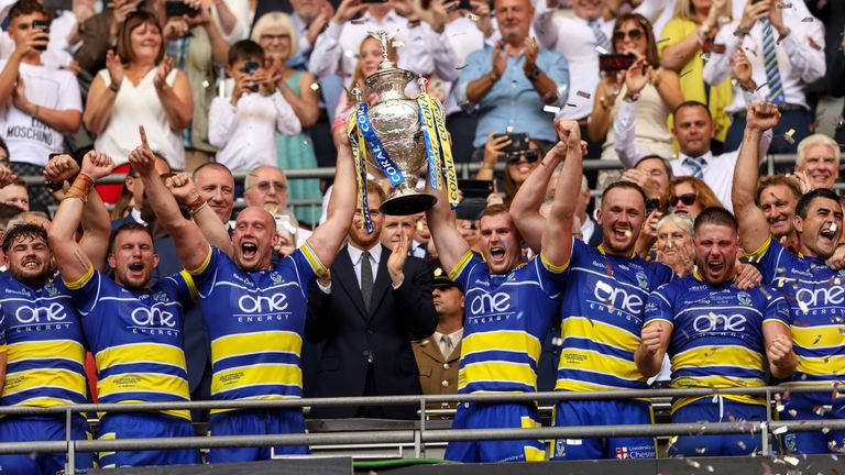 Warrington's  Clint Hill and Chris Hughes celebrate winning the Coral Challenge Cup Final at Wembley Stadium, London. PRESS ASSOCIATION Photo. Picture date: Saturday August 24, 2019. See PA story RUGBYL Final. Photo credit should read: Paul Harding/PA Wire. RESTRICTIONS: Editorial use only. No commercial use. No false commercial association. No video emulation. No manipulation of images.