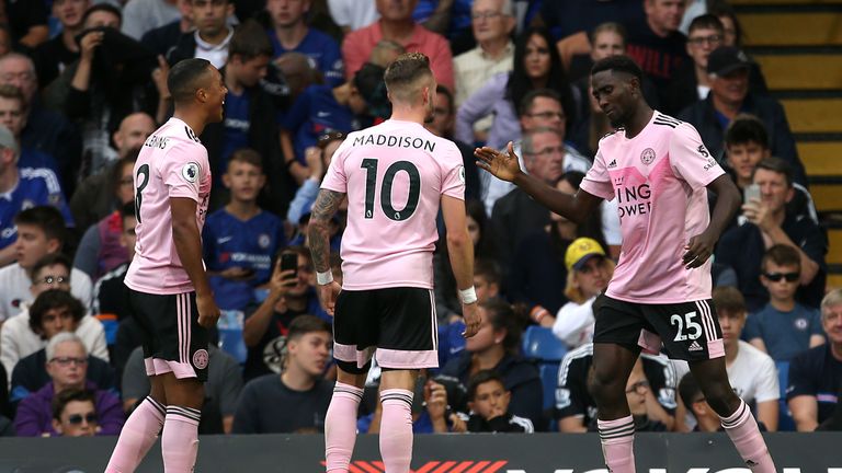 Leicester City's Wilfred Ndidi (right) celebrates scoring his side's first goal of the game with team-mates Youri Tielemans (left) and James Maddison during the Premier League match at Stamford Bridge, London.