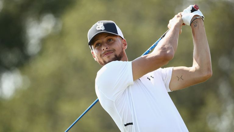 Stephen Curry hits a drive at the Ellie May Classic