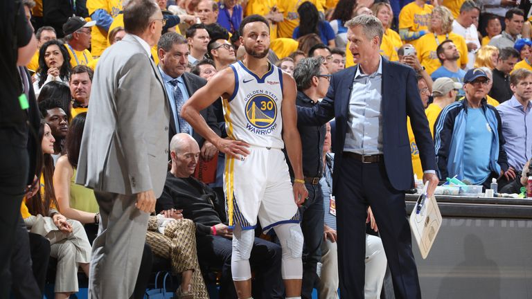 Steve Kerr gives instructions to Stephen Curry on the Warriors sideline
