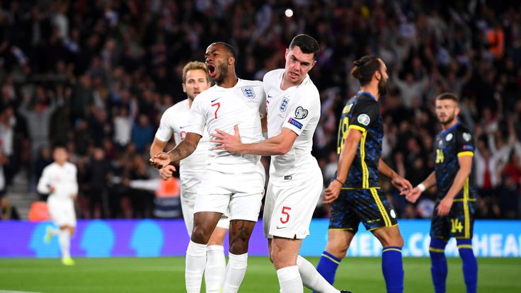 Raheem Sterling celebrates after scoring England's equaliser against Kosovo