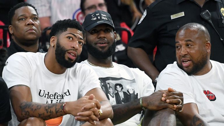 Anthony Davis and LeBron James watch Game 4 of the WNBA semi-finals