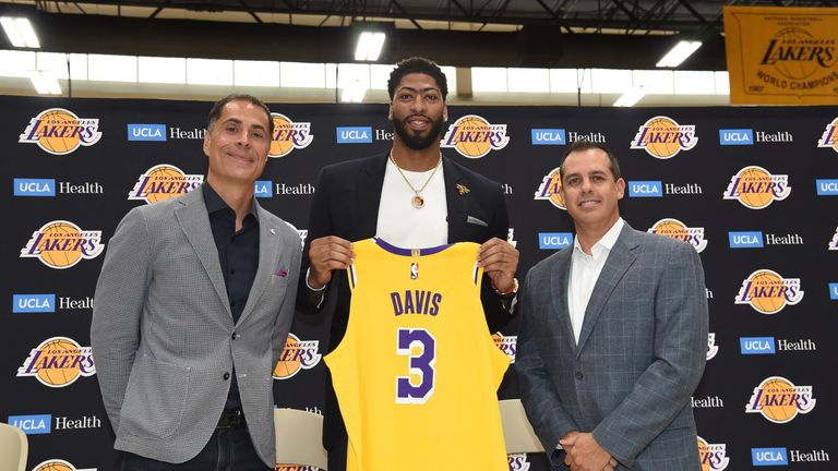 Anthony Davis, flanked by Lakers general manager Rob Pelinka and coach Frank Vogel, is introduced to the Los Angeles media