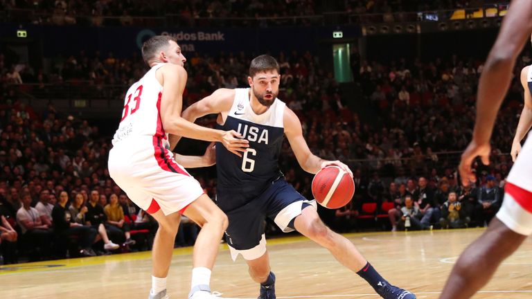 Joe Harris  drives at the Canada defense