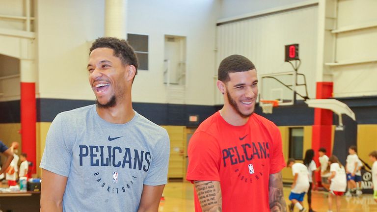 Josh Hart and Lonzo Ball share a joke at a Pelicans practice