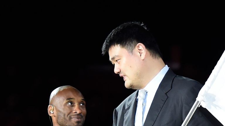 Kobe Bryant shares a word with Yao Ming at the FIBA World Cup final