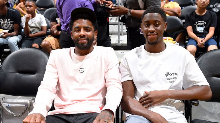 Kyrie Irving and Nets team-mate Caris LeVert pictured in Las Vegas attending a WNBA game