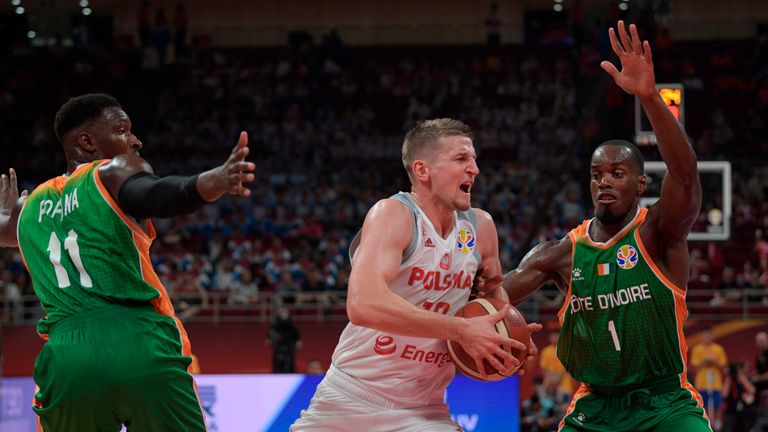 Adam Waczynski charges right at the Ivorian defence