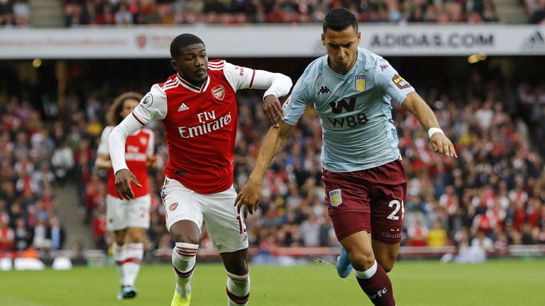 Ainsley Maitland-Niles (L) vies with Aston Villa's Anwar El Ghazi