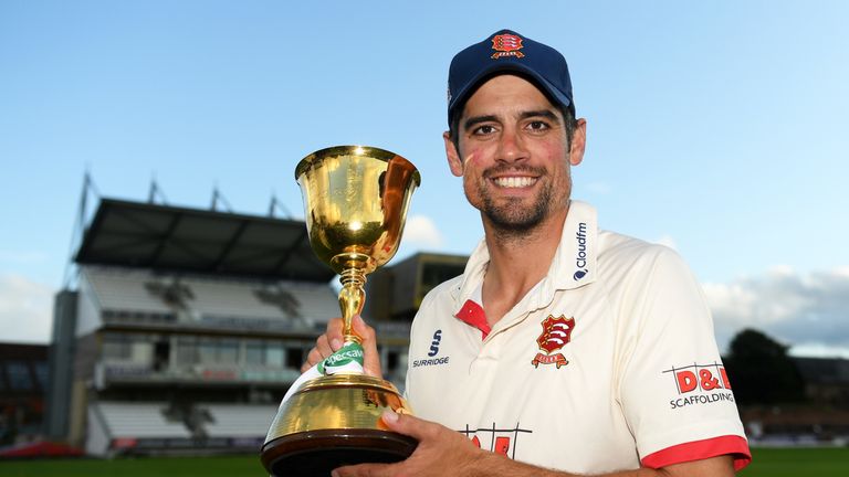 Essex opener Sir Alastair Cook holds the County Championship trophy