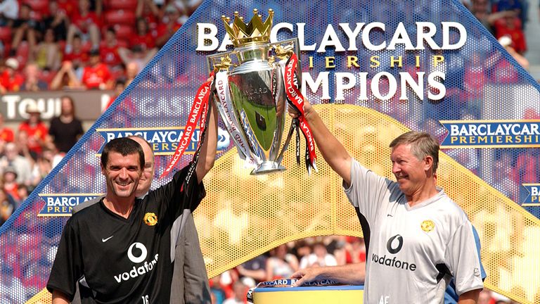 Roy Keane and Sir Alex Ferguson lift the Premiership trophy after the open training day at Old Trafford.       ..Manchester United's open training day, Old Trafford, 9 August 2003.