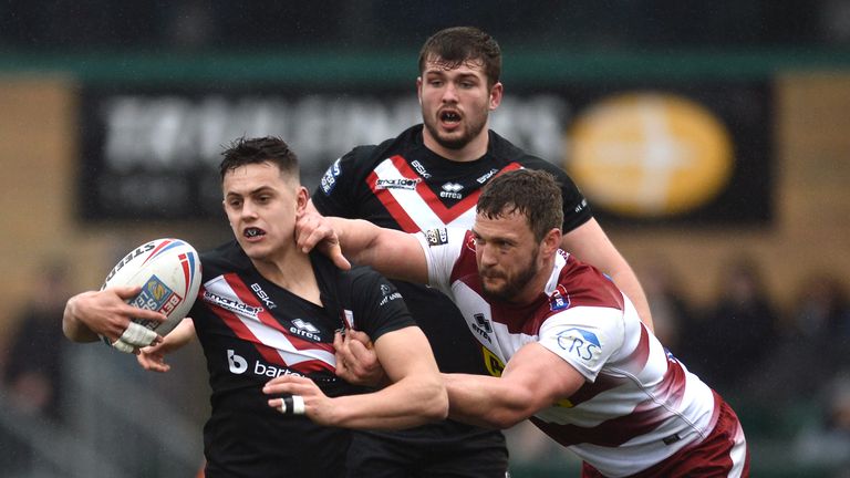 Picture by Richard Blaxall/SWpix.com - 03/03/2019 - Rugby League - Betfred Super League - London Broncos v Wigan Warriors - Trailfinders Sports Club, London, England - Alex Walker of London Broncos does battle with  George Williams of Wigan Warriors