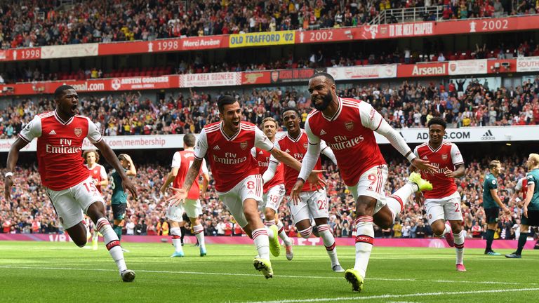 LONDON, ENGLAND - AUGUST 17: Alex Lacazette celebrates scoring for Arsenal with Ainsley Maitland-Niles and Dani Ceballos during the Premier League match between Arsenal FC and Burnley FC at Emirates Stadium on August 17, 2019 in London, United Kingdom. (Photo by Stuart MacFarlane/Arsenal FC via Getty Images)
