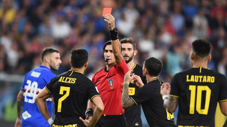 Alexis Sanchez is shown a red card during Inter's Serie A match against Sampdoria