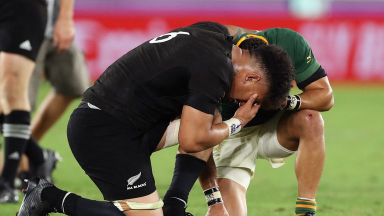 Ardie Savea shares a prayer with Cheslin Kolbe after the match