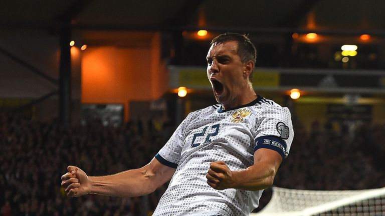 Artem Dzyuba celebrates scoring for Russia against Scotland