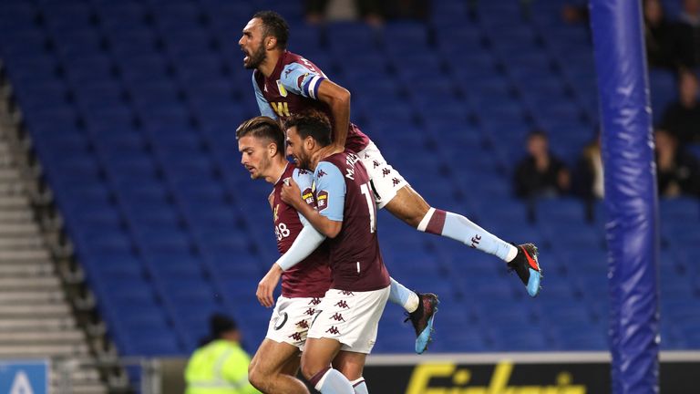 Aston Villa's Jack Grealish (left) celebrates scoring his side's third goal against Brighton