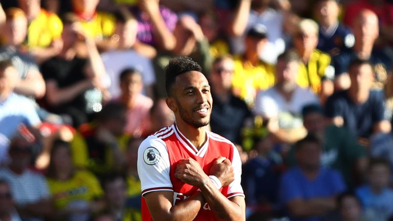 WATFORD, ENGLAND - SEPTEMBER 15: Pierre-Emerick Aubameyang of Arsenal celebrates as he scores his team's first goal during the Premier League match between Watford FC and Arsenal FC at Vicarage Road on September 15, 2019 in Watford, United Kingdom. (Photo by Julian Finney/Getty Images)